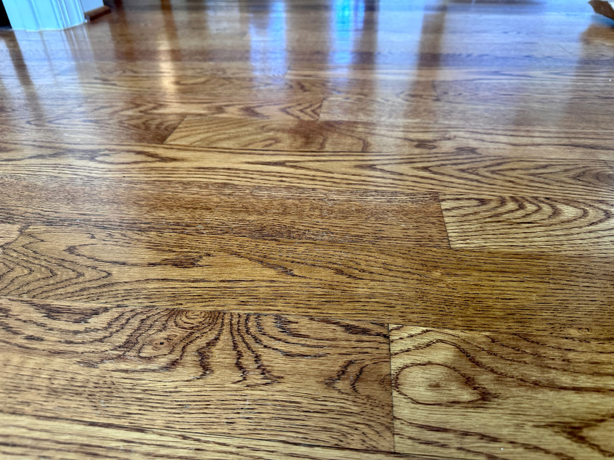 a finished hardwood floor showing closeup view