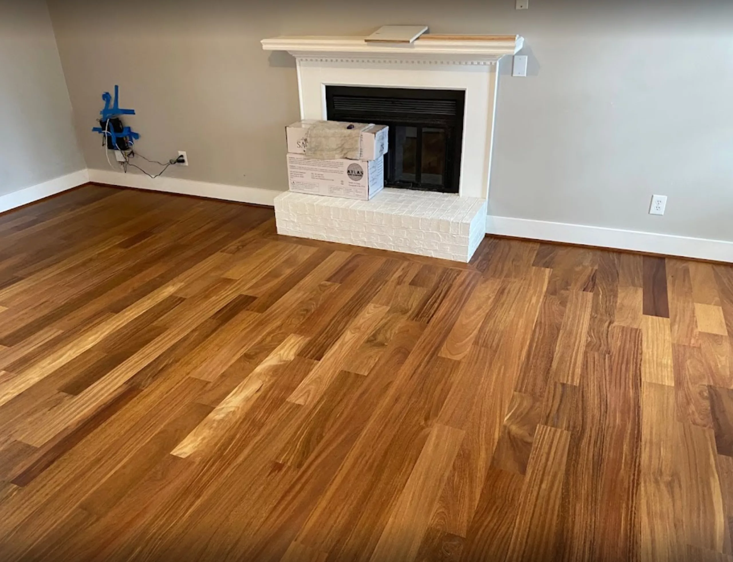 new hardwood floors in front of fireplace